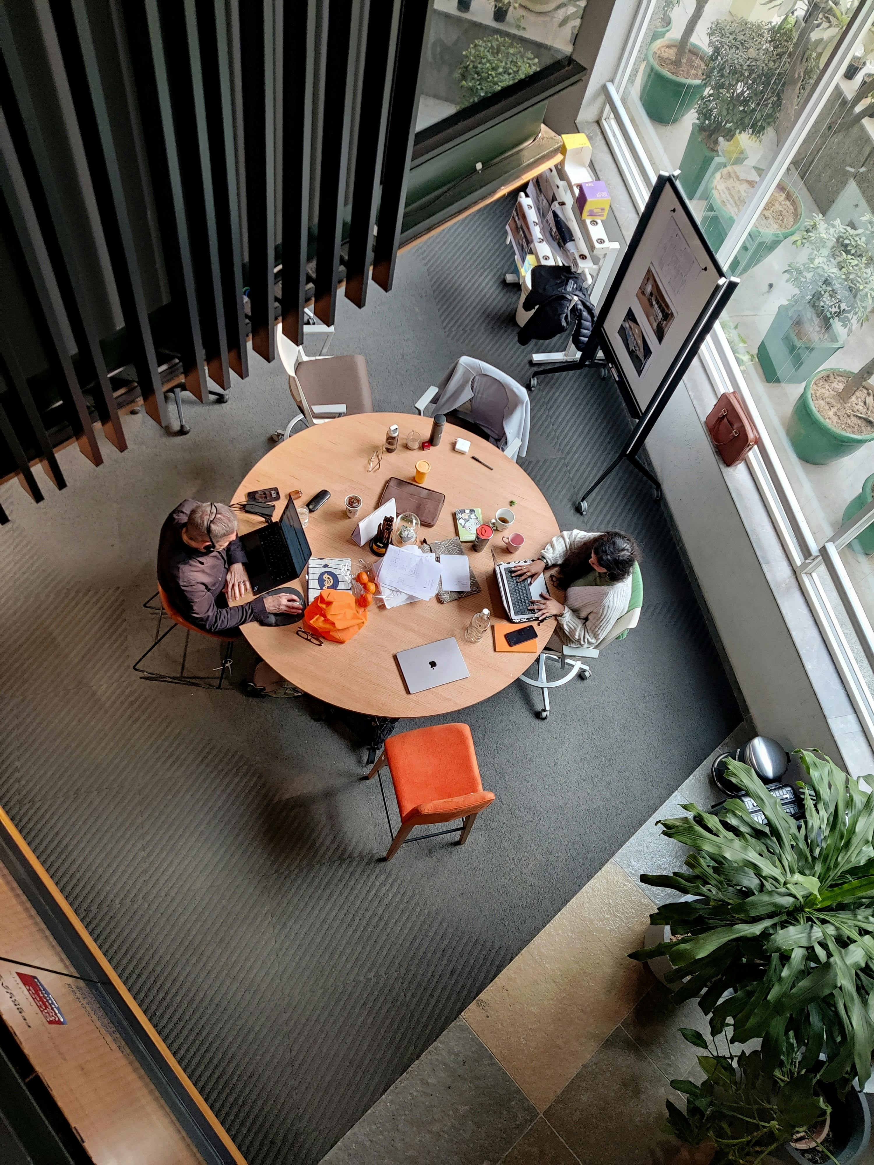 Modern office collaboration viewed from above during a planning and hiring session